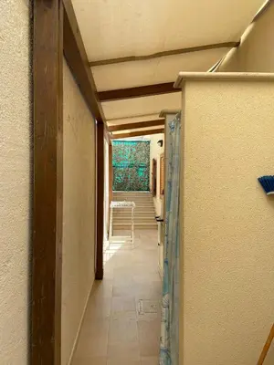 a hallway of a house with a table in the distance at Appartamento casa mare in Alcamo Marina