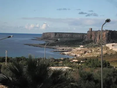 a view of a body of water with two street lights at Appartamenti Irene in Macari