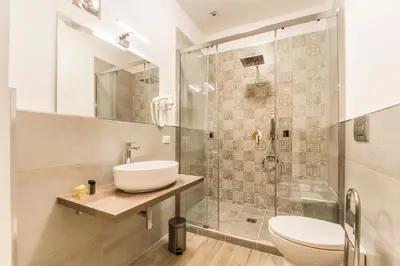 a bathroom with a sink and a shower at SheralKes Bed&Breakfast in Palermo