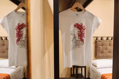 a pair of white t shirts hanging on a closet at Il Tempo Ritrovato - Locazione ad uso turistico in Palermo