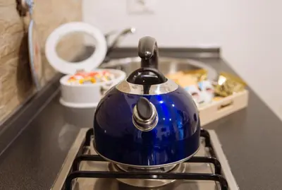 a blue tea kettle sitting on top of a stove at Il Tempo Ritrovato - Locazione ad uso turistico in Palermo