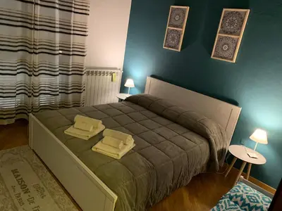 a bedroom with a bed with two pillows on it at Casa nel Vicolo in Palermo
