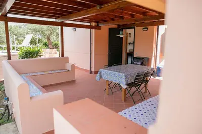 a view of a patio with a table and chairs at Villa Bruna in Cefalù