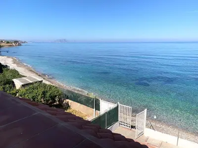 a view of the ocean from a balcony at Sfondo Blu Villa sul mare in Trabia