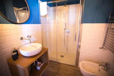 a bathroom with a sink and a shower at B&B Da Peppa in Castellammare del Golfo