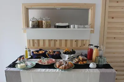 a table with several plates of food on it at B&B Da Peppa in Castellammare del Golfo