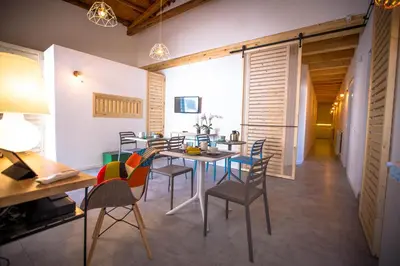 a dining room with a table and chairs at B&B Da Peppa in Castellammare del Golfo