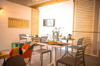 a dining room with tables and chairs and a window at B&B Da Peppa in Castellammare del Golfo