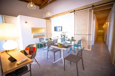 a room with a table and chairs and a dining room at B&B Da Peppa in Castellammare del Golfo