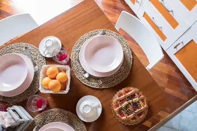 a table with plates and bowls of food on it at Centro Casa Monteleone in Palermo