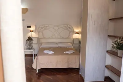 a bedroom with a bed with two towels on it at Centro Casa Monteleone in Palermo