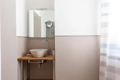 a bathroom with a sink and a mirror at Il Sonno dei Giusti Apartment by DomuSicily in Palermo