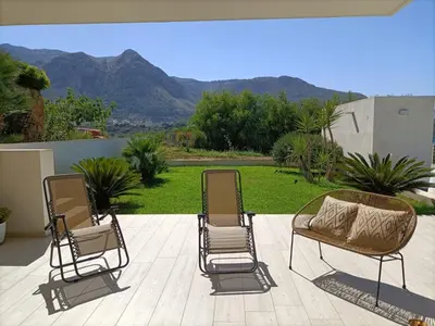 two chairs and a couch on a patio at Villa Flo in Castellammare del Golfo