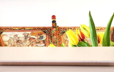 a purse with flowers in it on a table at Il Grazioso Giardinaccio in Palermo