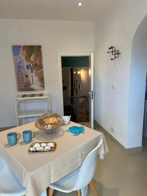 a table with a plate of food on top of it at Casa vacanze Al porticciolo romantico in Trappeto