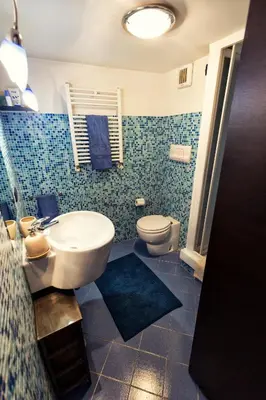 a bathroom with a sink and a toilet at Vista Cattedrale in Palermo
