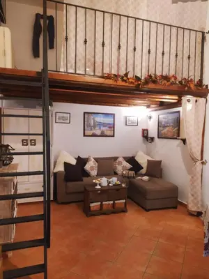 a living room with a couch and a loft at Casa Sicana in Palermo