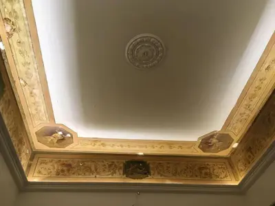a ceiling with a painting on the ceiling at Casa de Spuches in Palermo