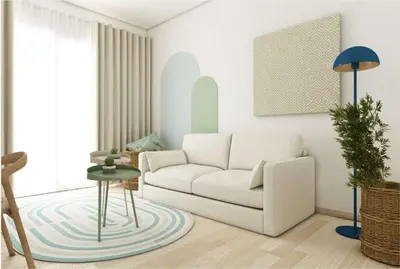 a living room with a white couch and a table at Hotel Torre Normanna in Altavilla Milicia