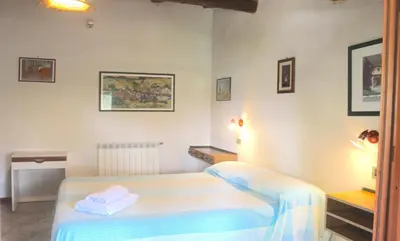 a room with a bed and a table with towels at VILLASEASICILY , POOL SALT WATER and NATURAL CHLORINE IN BALESTRATE - PALERMO in Balestrate