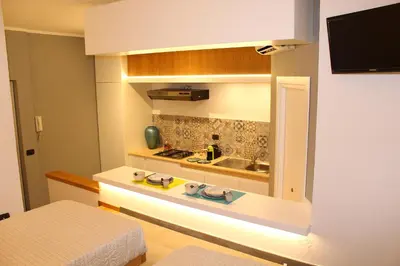 a small kitchen with a sink and a stove at Casa Siciliabedda in Capaci