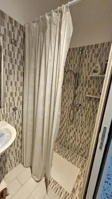 a shower with a shower curtain in a bathroom at Le Terrazze in Carini