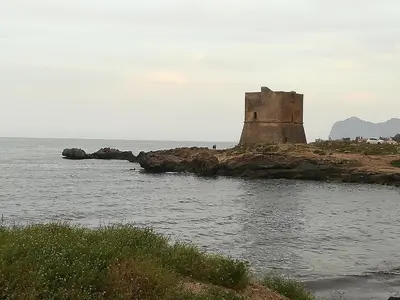 an old castle on an island in the water at Le Terrazze in Carini