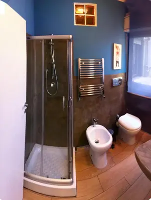 a bathroom with a shower and a toilet at B&B Montecarlo in Palermo