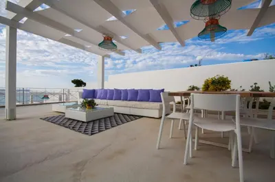 a living room with a couch and a table at Marina Beach Resort by Le Dhome Sicily in Balestrate