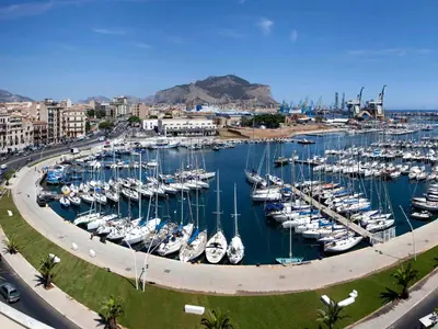 a marina filled with lots of boats in the water at Palazzo Filangeri di Amorosa in Palermo