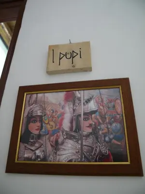 a picture of a woman in a costume on a wall at A Vanedda in Termini Imerese