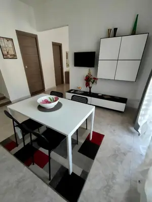 a white table and chairs in a living room at Casa Sciuti in Palermo