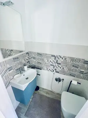 a bathroom with a sink and a toilet at Casa Sciuti in Palermo