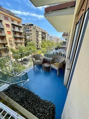 a balcony with two chairs and a table and chairs at Casa Sciuti in Palermo