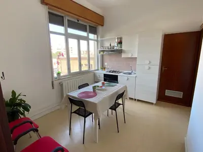 a kitchen with a table and chairs in a room at Casa Le Bellezze del Golfo in Castellammare del Golfo