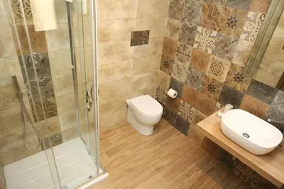 a bathroom with a toilet and a shower at Ninni e Fede in San Vito lo Capo