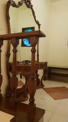 a wooden table with a mirror on top of it at Le Stelle del Massimo in Palermo