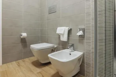 a bathroom with a toilet and a sink at Le Vele di Balestrate in Balestrate