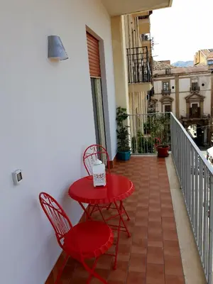 a living room with a couch and a table at 5 cupole in Palermo