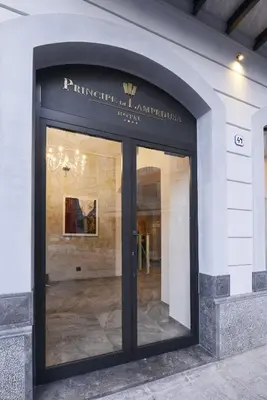 a glass door to a building with a sign on it at Best Western Hotel Principe di Lampedusa in Palermo