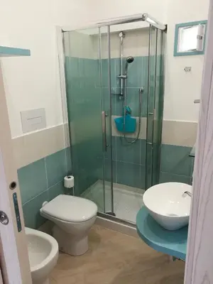 a bathroom with a shower and a toilet and a sink at I Paesaggi in Castellammare del Golfo