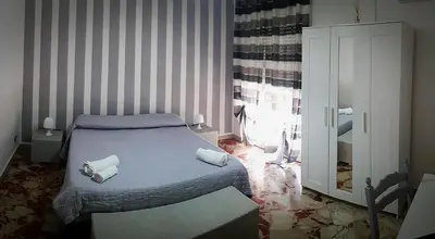 a bedroom with a bed with towels on it at Al Civico 8 - Palermo in Palermo