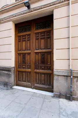 a large wooden door on the side of a building at Central Mezzanine in Palermo