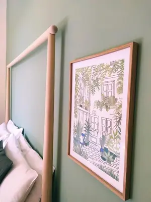a picture frame hanging on a wall with a picture at Sweet Roma 315 in Palermo