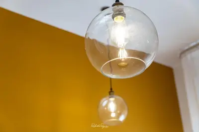 a glass light fixture hanging from a ceiling at Sweet Roma 315 in Palermo