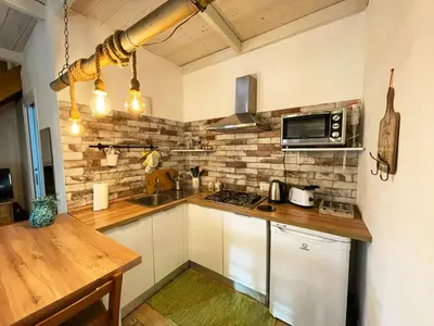 a kitchen with a counter top and a microwave at Baglio Reale Apartments in Palermo