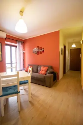 a living room with a couch and a table at Caleidoscopica Bahlara Ballarò in Palermo