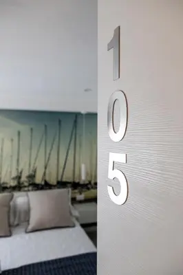 a wall with the number one in a bedroom at Suite Quaroni in Palermo