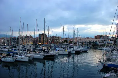 a bunch of boats are docked in a harbor at WelcHomeLoft in Palermo