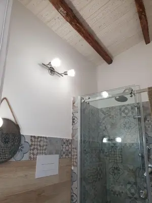 a bathroom with a shower with a ceiling at DE MEO Guest House in Castellammare del Golfo